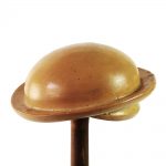 Round beret hat block with a brim feature around the edge.