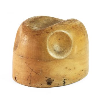 Classic trilby hat block with two dimples and an indentation on the top.