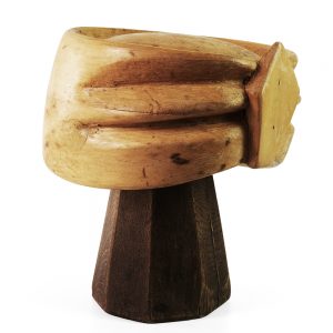 Sideview of crown hat block with a turban styled feature on one side.