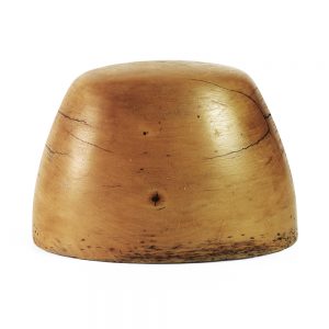 Sideview of small oval shaped crown hat block.